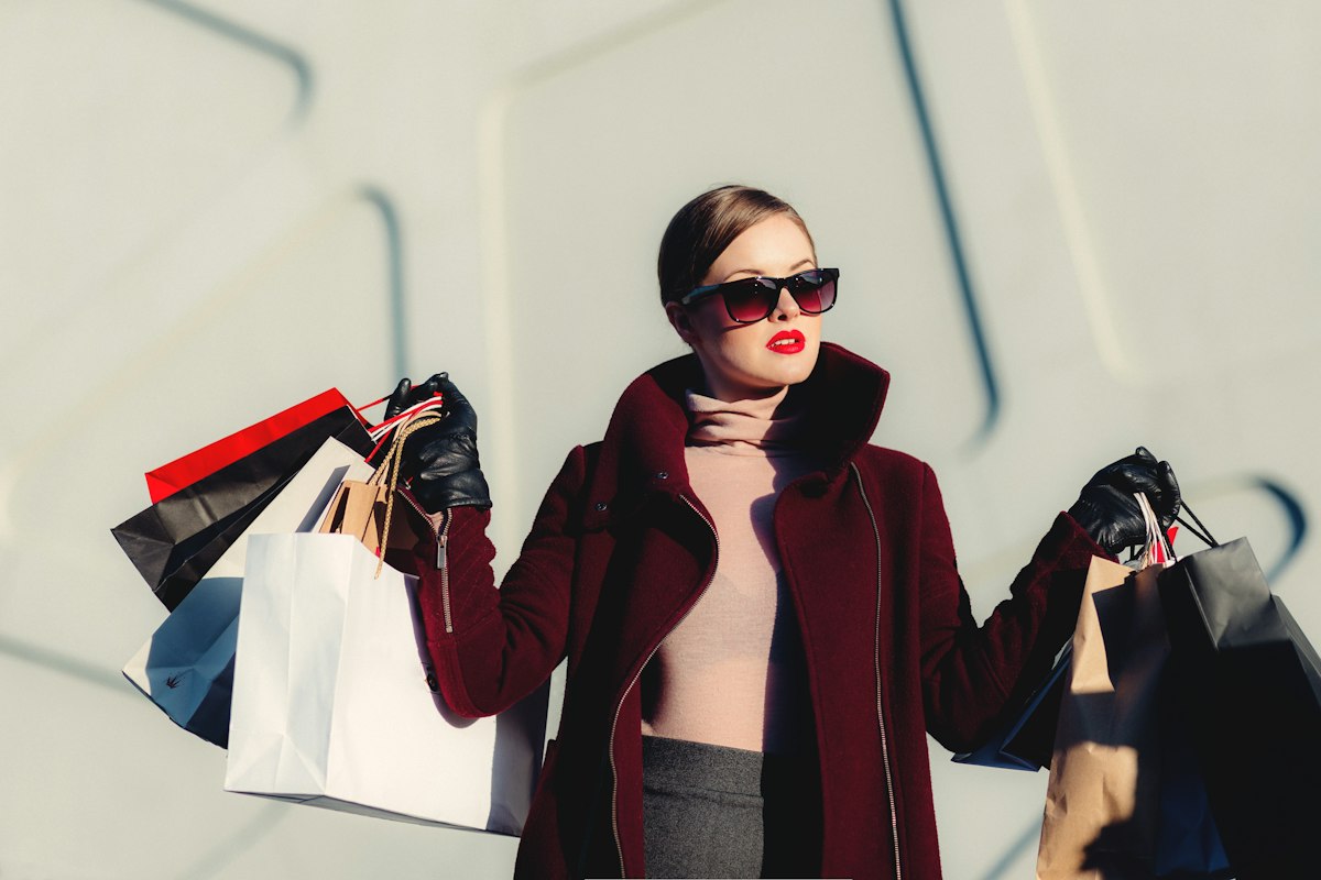 Woman with shopping bags in outlet